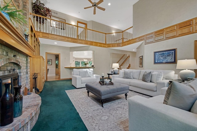 2 Pleasant Lake Rd, North Oaks, MN 55127 - living room with dark colored carpet, a ceiling fan, a high ceiling, stairway, and a brick fireplace
