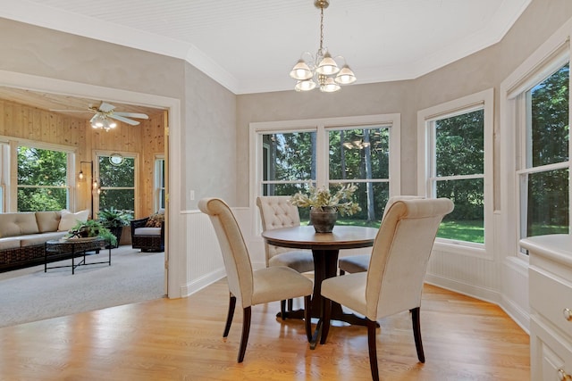 2 Pleasant Lake Rd, North Oaks, MN 55127 - dining room with a chandelier, light wood-type flooring, ornamental molding, and a ceiling fan