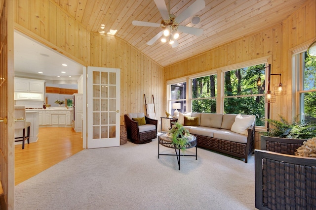 2 Pleasant Lake Rd, North Oaks, MN 55127 - living area with lofted ceiling, light colored carpet, wood walls, a ceiling fan, and wood ceiling