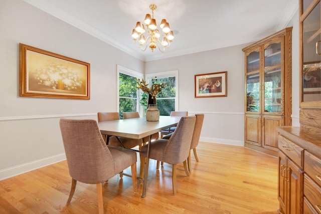2 Pleasant Lake Rd, North Oaks, MN 55127 - dining area featuring a chandelier, light wood-type flooring, and crown molding