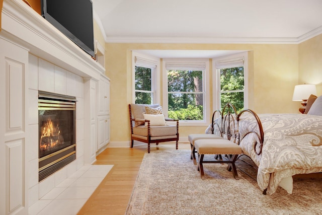 2 Pleasant Lake Rd, North Oaks, MN 55127 - bedroom with a fireplace, crown molding, and light wood-style flooring