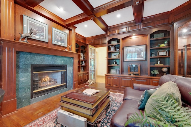 2 Pleasant Lake Rd, North Oaks, MN 55127 - living area featuring built in features, a fireplace, wood finished floors, beam ceiling, and coffered ceiling