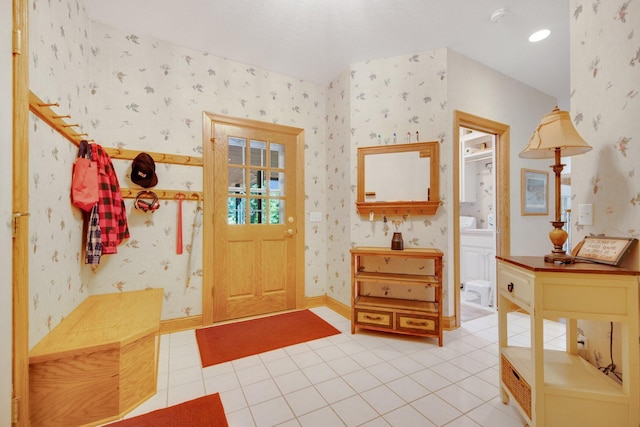 2 Pleasant Lake Rd, North Oaks, MN 55127 - entryway with wallpapered walls and light tile patterned floors
