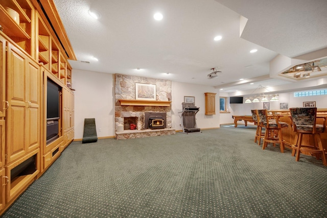 2 Pleasant Lake Rd, North Oaks, MN 55127 - carpeted living room featuring a bar, recessed lighting, and a stone fireplace