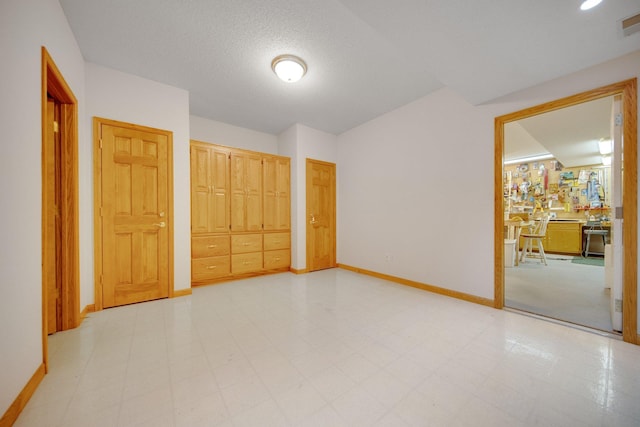 2 Pleasant Lake Rd, North Oaks, MN 55127 - unfurnished bedroom with a closet and a textured ceiling