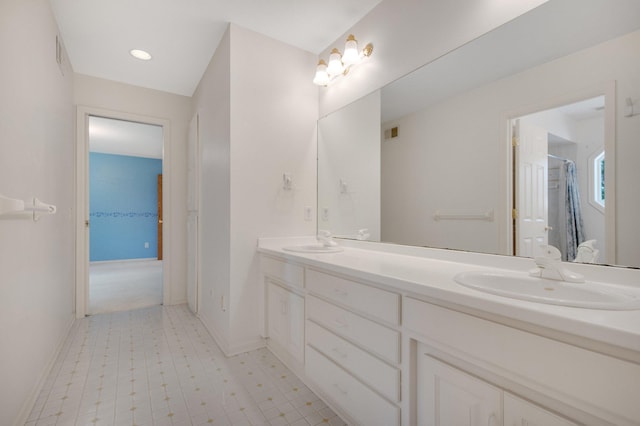 2 Pleasant Lake Rd, North Oaks, MN 55127 - full bathroom featuring double vanity, tile patterned floors, and a shower with curtain