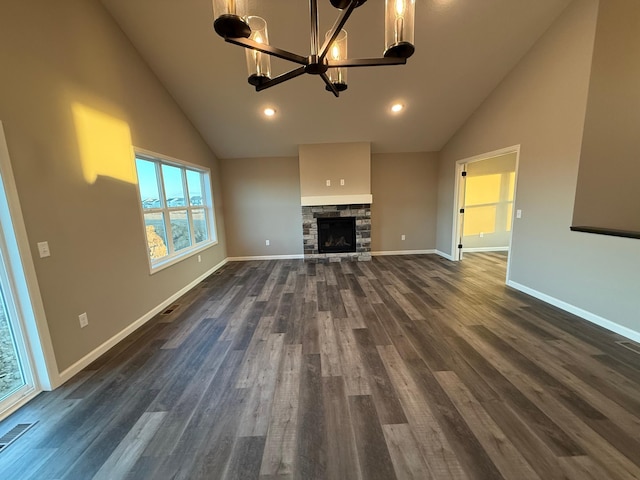 unfurnished living room with a chandelier, high vaulted ceiling, dark wood finished floors, baseboards, and recessed lighting