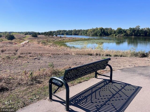 view of community with a water view