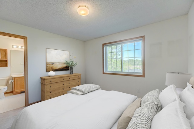 6147 Tahoe Cir Unit A, Woodbury, MN 55125 - bedroom with a textured ceiling and connected bathroom