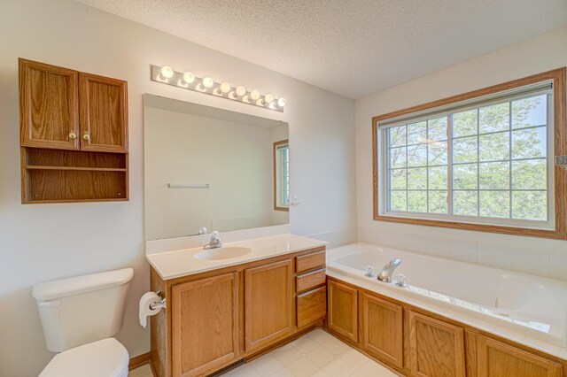 6147 Tahoe Cir Unit A, Woodbury, MN 55125 - full bathroom with vanity, a garden tub, and a textured ceiling