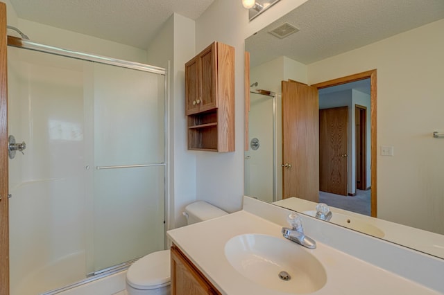 6147 Tahoe Cir Unit A, Woodbury, MN 55125 - bathroom with a shower stall, vanity, and a textured ceiling