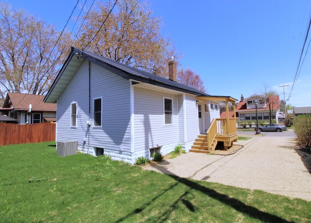 193 Griggs St N, Saint Paul, MN 55104 - view of home's exterior featuring a chimney and central AC