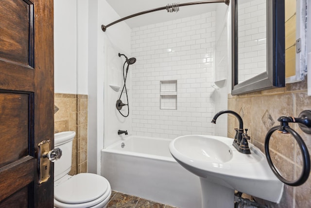 193 Griggs St N, Saint Paul, MN 55104 - full bath with tile walls, toilet, washtub / shower combination, and stone finish flooring