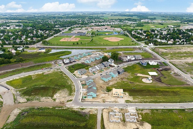 view of property location with a nearby body of water and nearby suburban area