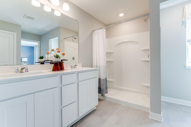 205 Snowdrop Trl, Waconia, MN 55387 - bathroom featuring a shower with curtain and double vanity