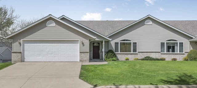 view of front of house with brick siding, driveway, an attached garage, a front yard, and roof with shingles