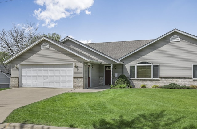 view of front of house with a garage, brick siding, concrete driveway, and a front lawn