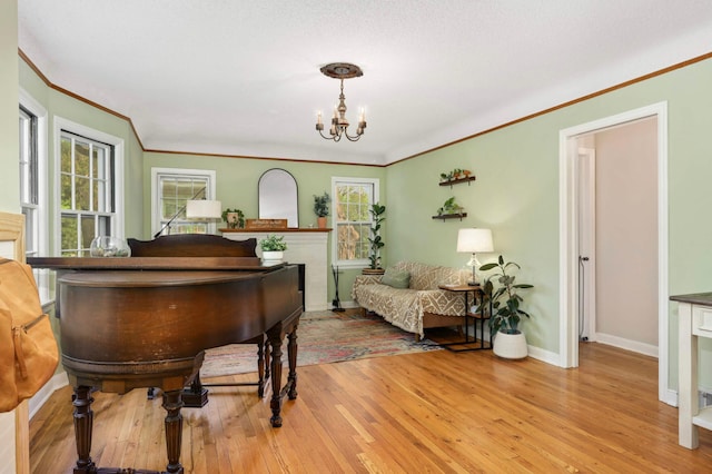 3338 Brownlow Ave, Saint Louis Park, MN 55426 - living area with ornamental molding, a chandelier, light wood-type flooring, and baseboards