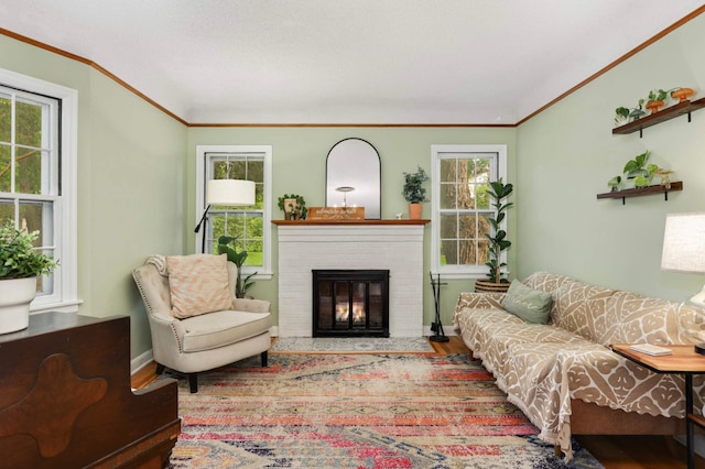 3338 Brownlow Ave, Saint Louis Park, MN 55426 - living area with ornamental molding, plenty of natural light, wood finished floors, a brick fireplace, and baseboards