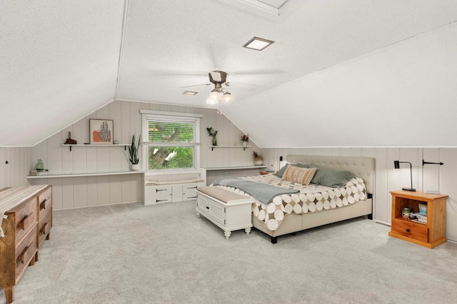 3338 Brownlow Ave, Saint Louis Park, MN 55426 - bedroom featuring lofted ceiling, carpet floors, a textured ceiling, ceiling fan, and wood walls