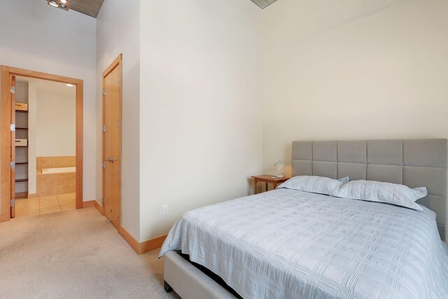 carpeted bedroom with baseboards