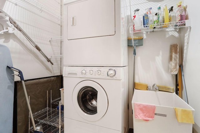 laundry room with stacked washer and clothes dryer
