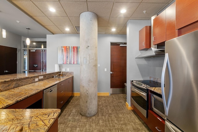 kitchen featuring appliances with stainless steel finishes, wall chimney exhaust hood, a sink, dark carpet, and baseboards
