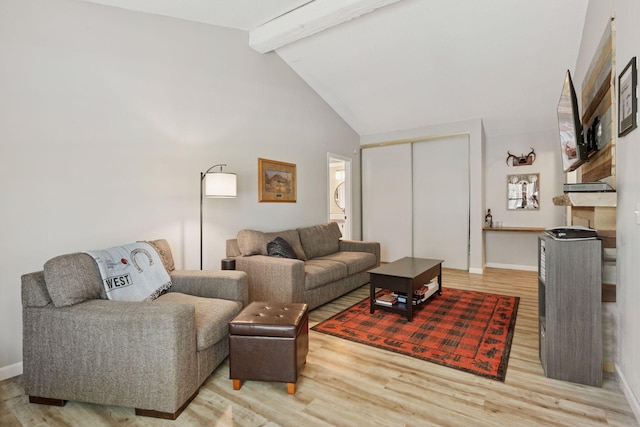 4430 Cedar Lake Rd S Unit 6, Saint Louis Park, MN 55416 - living room with wood finished floors, beamed ceiling, baseboards, and high vaulted ceiling
