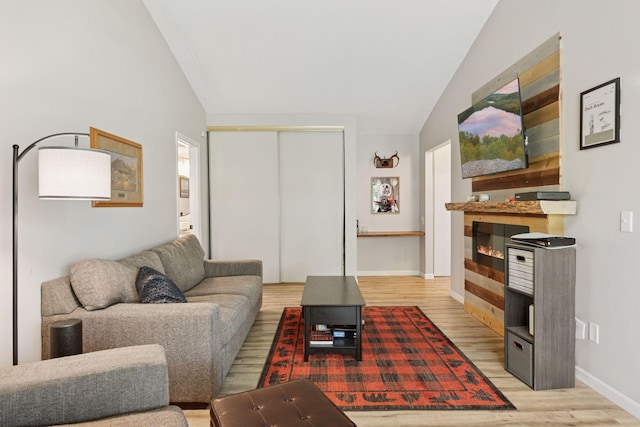 4430 Cedar Lake Rd S Unit 6, Saint Louis Park, MN 55416 - living room with vaulted ceiling, light wood-type flooring, and baseboards