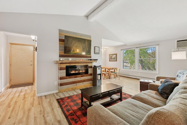 4430 Cedar Lake Rd S Unit 6, Saint Louis Park, MN 55416 - living area with wood finished floors, a glass covered fireplace, a baseboard radiator, and baseboards