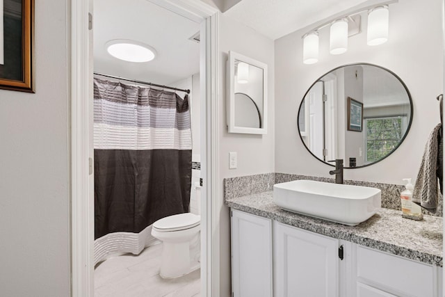 4430 Cedar Lake Rd S Unit 6, Saint Louis Park, MN 55416 - full bath featuring vanity, toilet, curtained shower, and tile patterned flooring