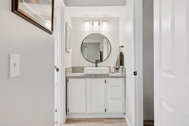 4430 Cedar Lake Rd S Unit 6, Saint Louis Park, MN 55416 - bathroom with wood finished floors and vanity