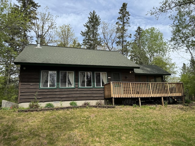 27721 Northwoods Dr, Laporte, MN 56461 - rear view of house featuring a deck, a yard, and a shingled roof