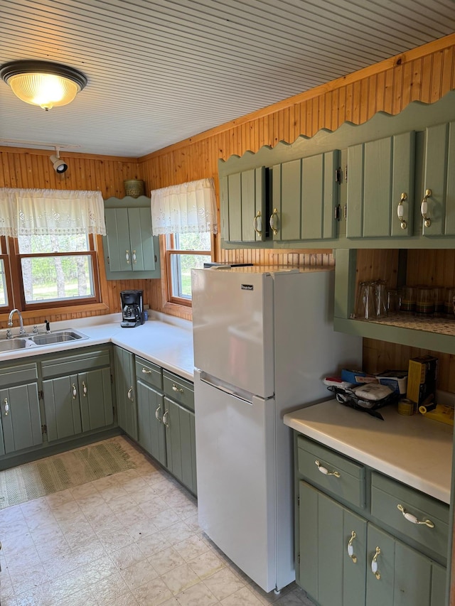 27721 Northwoods Dr, Laporte, MN 56461 - kitchen featuring a sink, freestanding refrigerator, light floors, light countertops, and green cabinetry