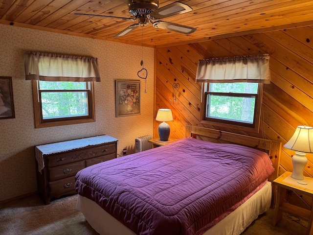 27721 Northwoods Dr, Laporte, MN 56461 - bedroom with multiple windows, wood ceiling, radiator heating unit, carpet floors, and wallpapered walls