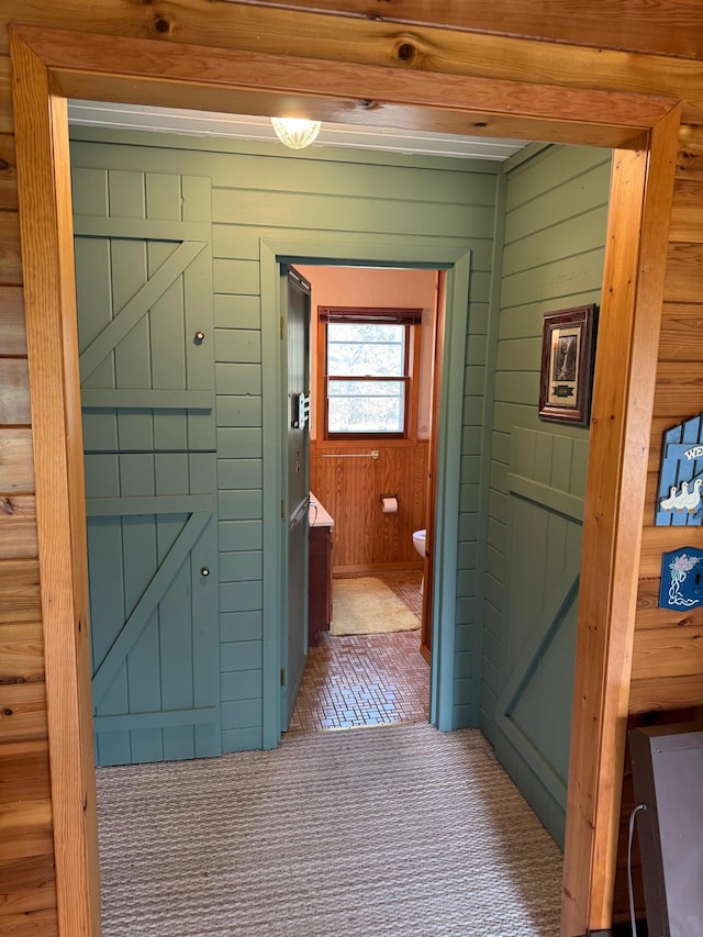27721 Northwoods Dr, Laporte, MN 56461 - hall with brick flooring and wooden walls