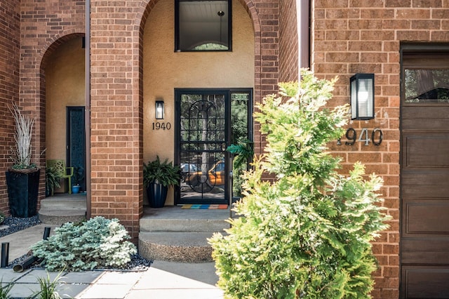 1940 Dupont Ave S, Minneapolis, MN 55403 - doorway to property featuring brick siding and stucco siding