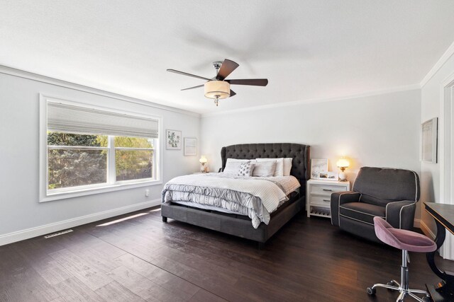bedroom featuring ornamental molding, dark wood-style floors, baseboards, and a ceiling fan