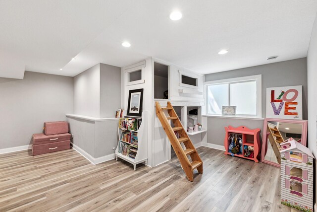 game room with wood finished floors, baseboards, and recessed lighting