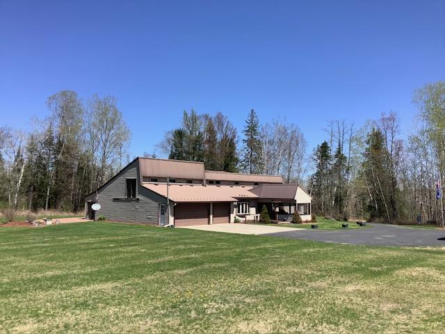 19323 Wendigo Park Rd, Harris Twp, MN 55744 - rear view of property with driveway and a yard