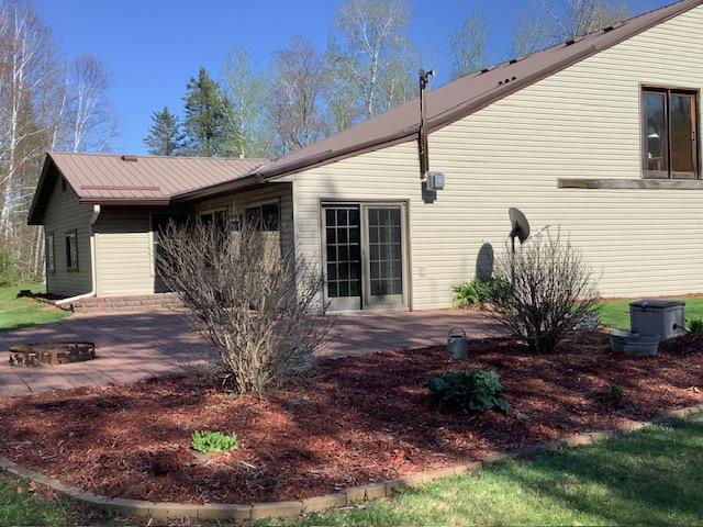 19323 Wendigo Park Rd, Harris Twp, MN 55744 - view of side of home with a patio area