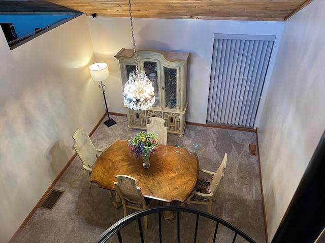 19323 Wendigo Park Rd, Harris Twp, MN 55744 - carpeted dining space with wood ceiling and baseboards