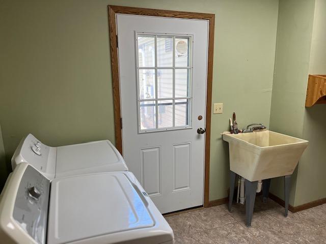 19323 Wendigo Park Rd, Harris Twp, MN 55744 - washroom with independent washer and dryer, baseboards, and healthy amount of natural light