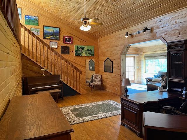 19323 Wendigo Park Rd, Harris Twp, MN 55744 - office area with wooden walls, wood ceiling, light wood-style flooring, ceiling fan, and lofted ceiling