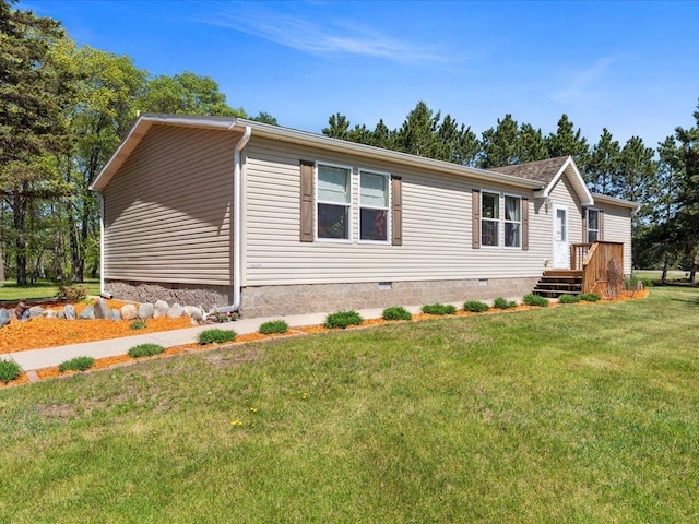 view of front of home with crawl space and a front lawn