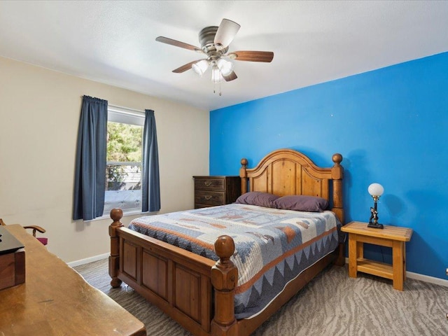 bedroom with baseboards and a ceiling fan