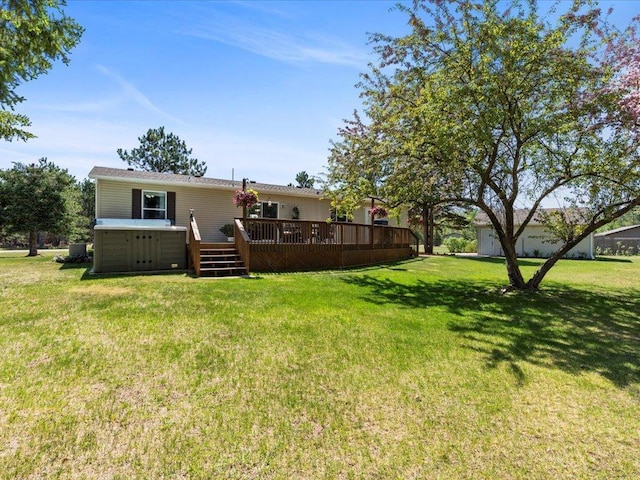 back of house with a deck and a lawn