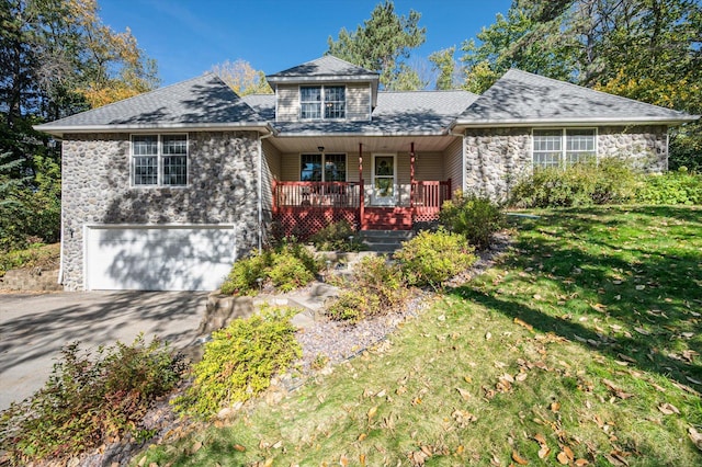 771 County Road B2 E, Little Canada, MN 55117 - view of front of house featuring stone siding, driveway, a garage, covered porch, and a shingled roof