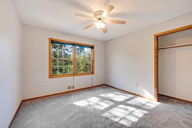771 County Road B2 E, Little Canada, MN 55117 - unfurnished bedroom featuring carpet flooring, a textured ceiling, baseboards, and ceiling fan