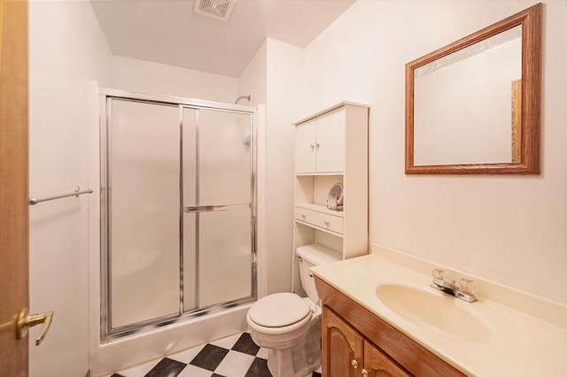 771 County Road B2 E, Little Canada, MN 55117 - bathroom with a shower with door, toilet, tile patterned floors, and vanity